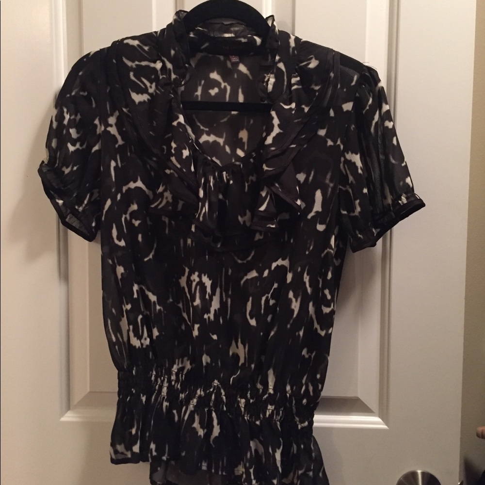 Limited sheer blouse with ruffle details